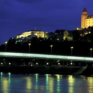 Slovakia, Bratislava. Evening view of Bratislava Castle and Slovak National Parliament