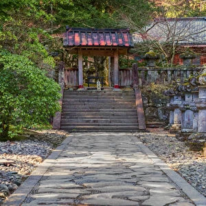 Stone path and red Japanese temple