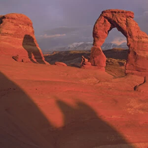 Sunset light on Delicate Arch wit the La Sal Mountains in the background, Arches nat l Park