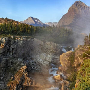 Swift current Falls at sunrise in Glacier National Park, Montana, USA