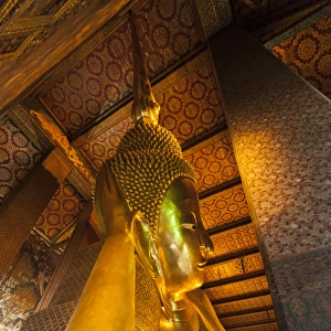 Thailand, Bangkok. Reclining Buddha inside Wat Pho