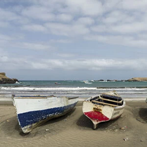 Traditional fishing boats on the beach of Praia Baixo. Santiago Island, Cape Verde