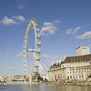 UK, London. London Eye ferris wheel on the banks of the Thames River