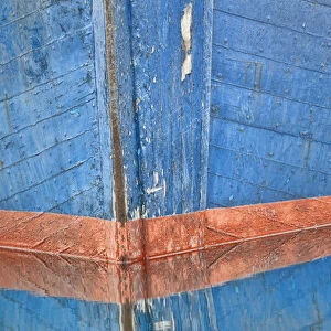 USA, Alaska, Hoonah. Abstract of fishing boat bow reflecting in water. Credit as