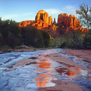 USA; Arizona; Sedona; Cathedral Rock reflecting in Oak Creek at Sunset