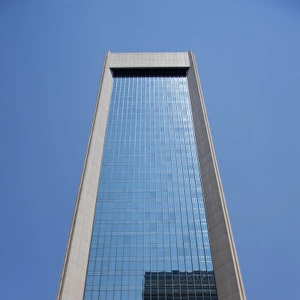 USA, Florida, Jacksonville, Clear blue sky reflected off glass office tower in downtown