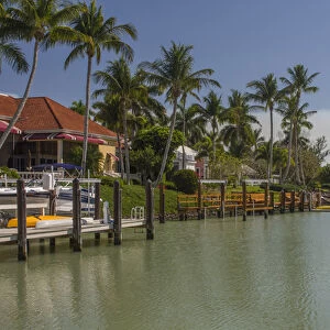 USA, Florida, Naples. Luxury homes in the Port Royal neighborhood line a canal by