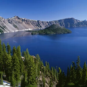 USA, Oregon. Crater Lake National Park, Wizard Island and Crater Lake with a grove
