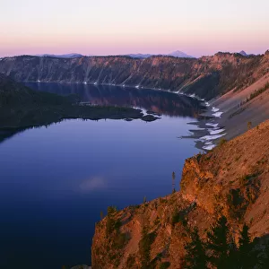 USA, Oregon. Crater Lake National Park, sunrise light on Wizard Island, view south