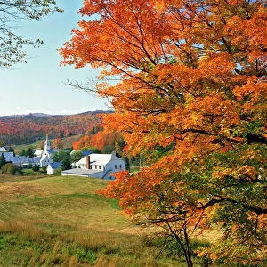 USA, Vermont, East Corinth. Fall colors framing church and town. Credit as: Steve