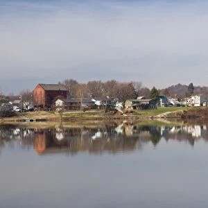 USA, WV, Parkersburg. Belpre, Ohio seen from Point Park on perfect calm day