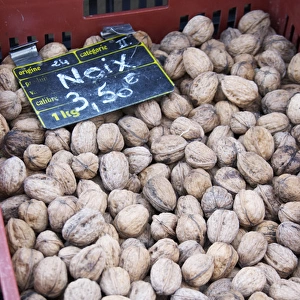 Walnuts for sale at a market stall at the market in Bergerac for 3. 50 euro per kilo