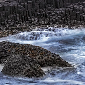 Waves crash into basalt at the Giants Causeway in County Antrim, Northern Ireland