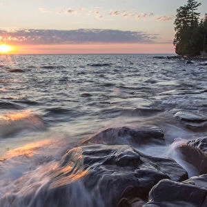 Waves crash at sunset on Devils Island in the Apostle Islands National Lakeshore