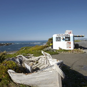 Wooden dinghy, and Nins Bin lobster caravan, Kaikoura Coast, Marlborough, South Island