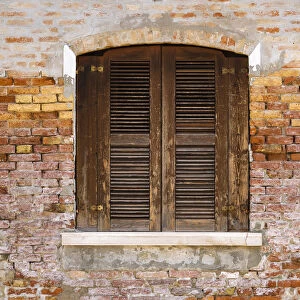 Wooden shutters and brick wall, Burano, Veneto, Italy