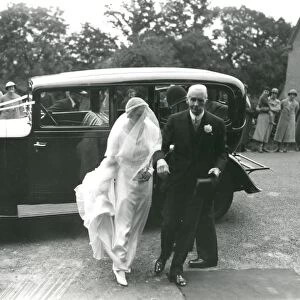 Bride with father arriving at the church, June 1936