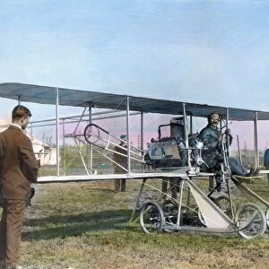 American aviation pioneer. Posing at the controls of the Baby Grand, the Wright entry in the Gordon Bennett races at Belmont Park, New York, October 1910. Oil over a photograph