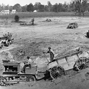 ARKANSAS: LEVEES, 1922. Construction of levees using tractor-drawn wagons near Wyanoke