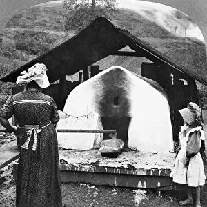Baking bread at Scottsdale, Pennsylvania. Stereograph, 1905