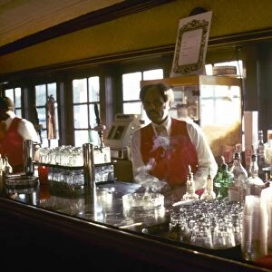 Bartenders working on a showboat on the Mississipi River at St. Louis, Missouri. Photographed c1974
