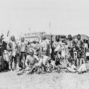BLACKFOOT GROUP, c1907. Chief Running Wolf and a group of Blackfoot tribe members
