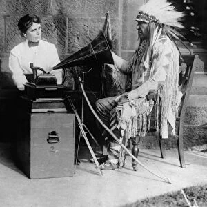 BLACKFOOT AND PHONOGRAPH. Mountain Chief (Ninastoko), chief of the Blackfoot Native