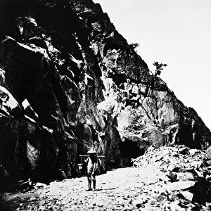 CALIFORNIA: RAILROAD, c1865. A Chinese laborer coming from the East Portal, Tunnel No