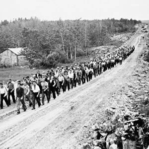 CANADA: UNEMPLOYED, 1935. March of unemployed men from relief camps in western Canada to Ottawa, to demand jobs at decent wages from the federal government, photographed near the Manitoba-Ontario border, 1935