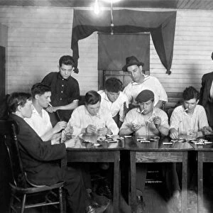 CARD GAME, 1916. A group of young Portuguese-American mill workers from Fall River