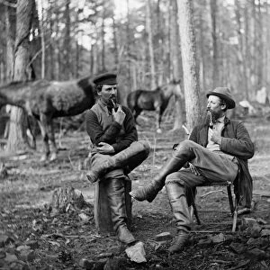 CIVIL WAR: SOLDIERS, 1864. Two soldiers (probably Confederate) smoking pipes at Brandy Station, Virginia. Photograph, 1864