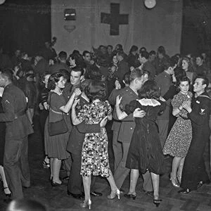 DANCING, c1940. Men and women at a Red Cross dance. Photograph, c1940