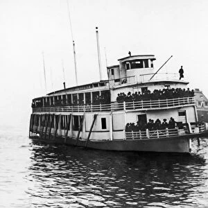 ELLIS ISLAND FERRY, c1920. The ferry taking immigrants from Ellis Island to lower Manhattan