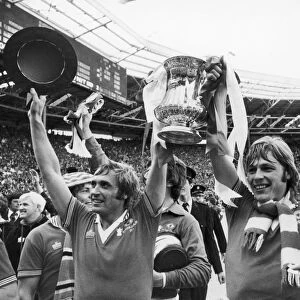 ENGLAND: FA CUP, 1977. Jimmy Greenhoff (left) and Brian Greenhoff of Manchester United celebrate their victory over Liverpool F. C. in the FA Cup final, 21 May 1977