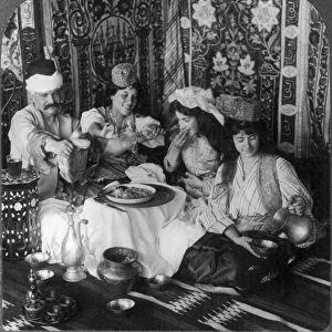 Feasting in the harem, Constantinople, Turkey. Stereograph, c1913