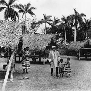 FLORIDA: SEMINOLE VILLAGE. A group of Seminole Native Americans at Musa Isle, a