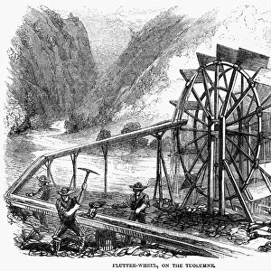GOLD MINING, 1860. Gold miners using a flutter wheel on the Tuolumne River in California. Wood engraving, American, 1860