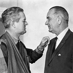 Governor of Texas John Connally, with his arm still in a sling after being injured during the assassination of John F. Kennedy, speaks with president Lyndon Johnson. Photograph, January 1964