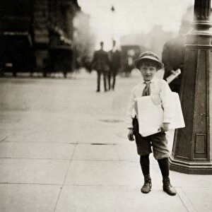 HINE: NEWSBOYS, 1912. A six-year-old newsboy selling paper in Washington, D