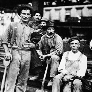 IMMIGRANT LABOR, 1910. A group of Italian immigrant street construction workers