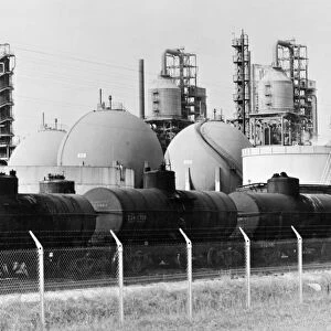 INDUSTRY: OIL REFINERY. Railroad cars lined up to receive cargoes gasoline from a refinery