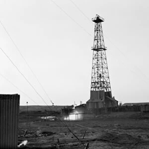 IRAQ: OIL DRILL, 1932. A drilling tower at an oil field in Iraq. Photograph, 1932
