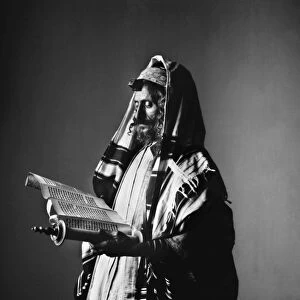 JERUSALEM: RABBI. A rabbi in Jerusalem wearing the prayer robe, holding a scroll and phylacteries