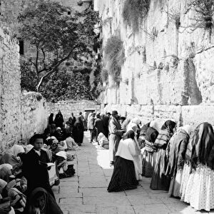 JERUSALEM: WAILING WALL. Jews praying at the Western Wall or Wailing Wall in the