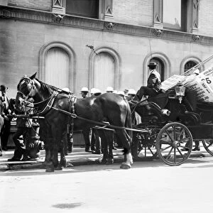 LABOR DAY PARADE, c1908. Horse-drawn buggy carrying picket signs in preparation