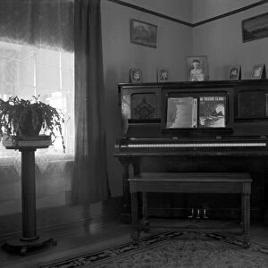 LIVING ROOM, 1936. The corner of a farmhouse living room, near Dickens, Iowa