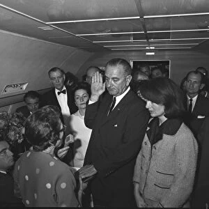 LYNDON BAINES JOHNSON (1908-1973). 36th President of the United States. Johnson being sworn in as the 36th President of the United States by Judge Sarah T. Hughes aboard Air Force One at Love Field, Dallas, Texas, 22 November 1963. Photograph by Cecil Stoughton