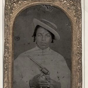 MAN, c1865. Portrait of a civilian man holding a revolver. Tintype, c1865
