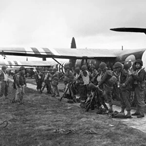 Members of the 439th Troop Carrier Group await the signal to board a CF-4 glider to take part in the invasion of Normandy. Photograph, 4 June 1944
