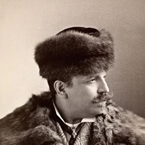 MENs FASHION, 1890s. Unidentified man sporting a fur coat and fur hat, 1890s